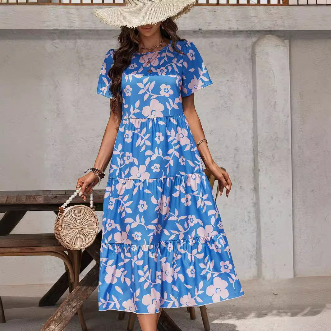 Ladies airy tiered midi dress with high waist seam, short sleeve and all-over floral pattern Mune Fashion