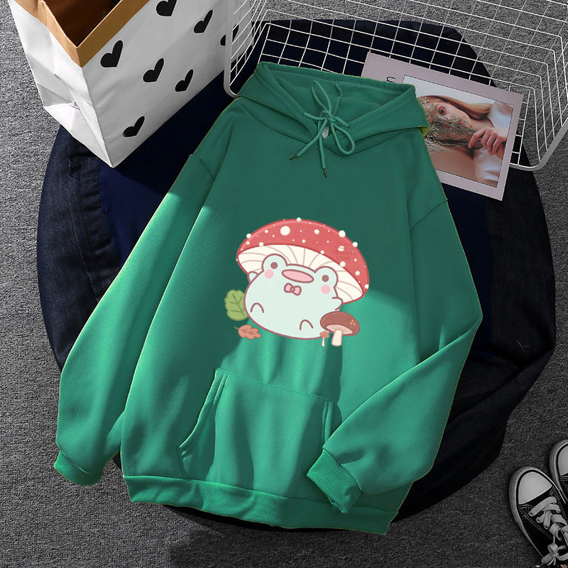 Women’s soft oversized hoodie with kawaii mushroom frog print, kangaroo pocket, and ribbed cuffs Mune Fashion