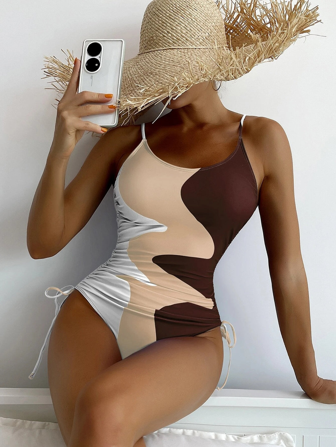Women's one-piece swimsuit with playful cut-outs and floral design Mune Fashion