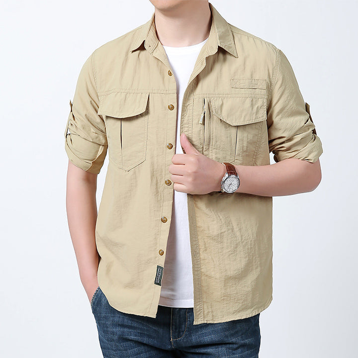 Men's long-sleeved field shirt made of lightweight ripstop with multifunctional chest pockets and concealed zip.