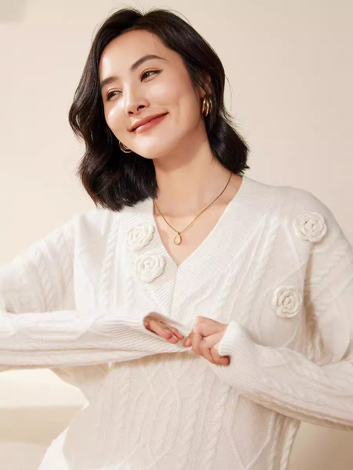 Women's cable knit V-neck sweater with three-dimensional floral appliqués made from soft wool blend Mune Fashion