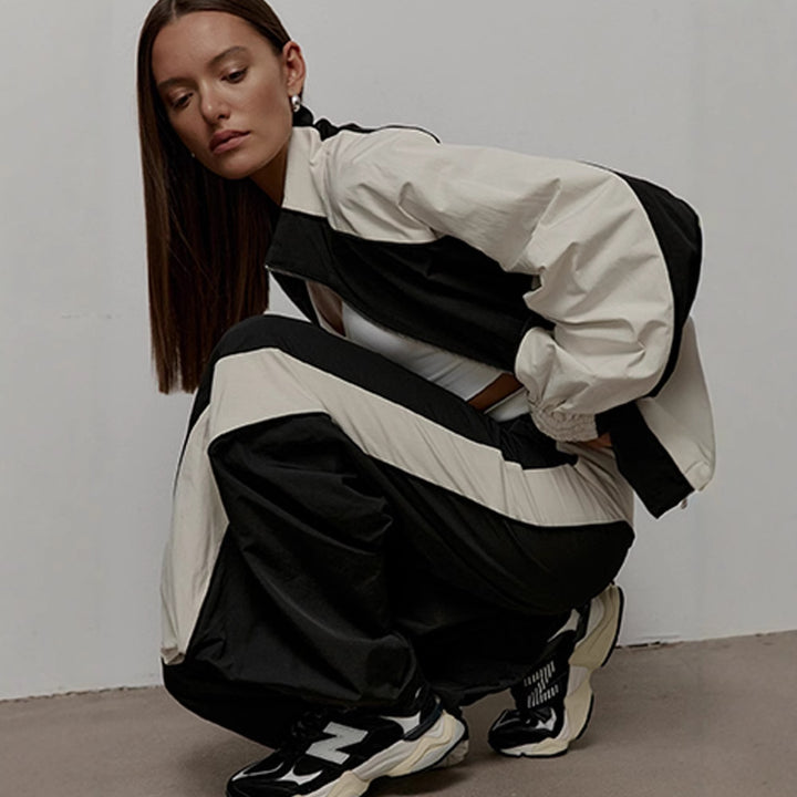 Women's oversized sporty track jacket with high stand-up collar and raglan sleeves Mune Fashion