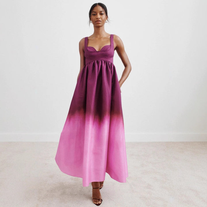 Women's floor-length bustier maxi dress with heart-shaped neckline, wide straps, and gathered empire waist Mune Fashion