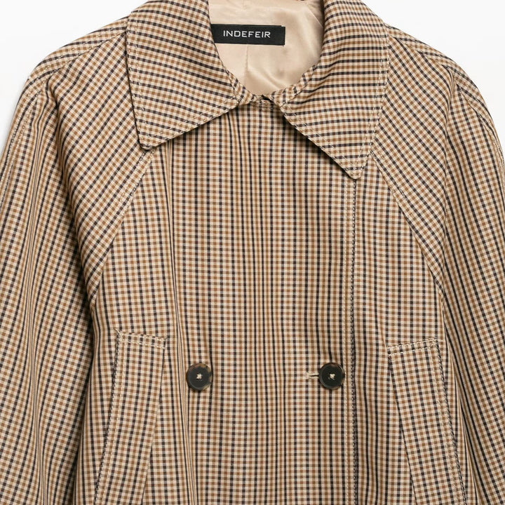 Women's short trench coat in Glencheck with boxy silhouette, tie belt and raglan sleeves Mune Fashion