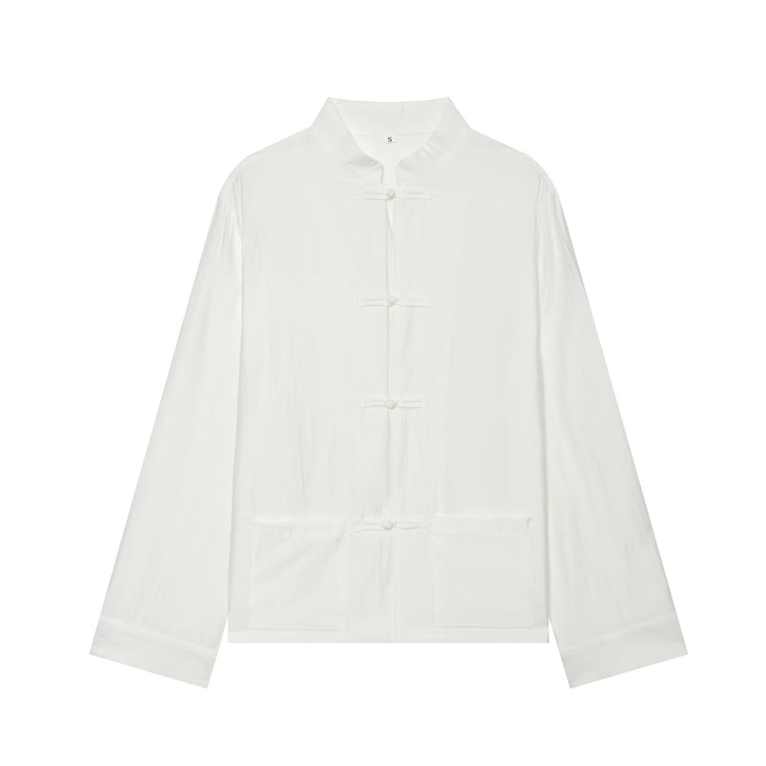 Women's Asian-inspired transitional jacket with stand-up collar, knot closures, and patch pockets Mune Fashion