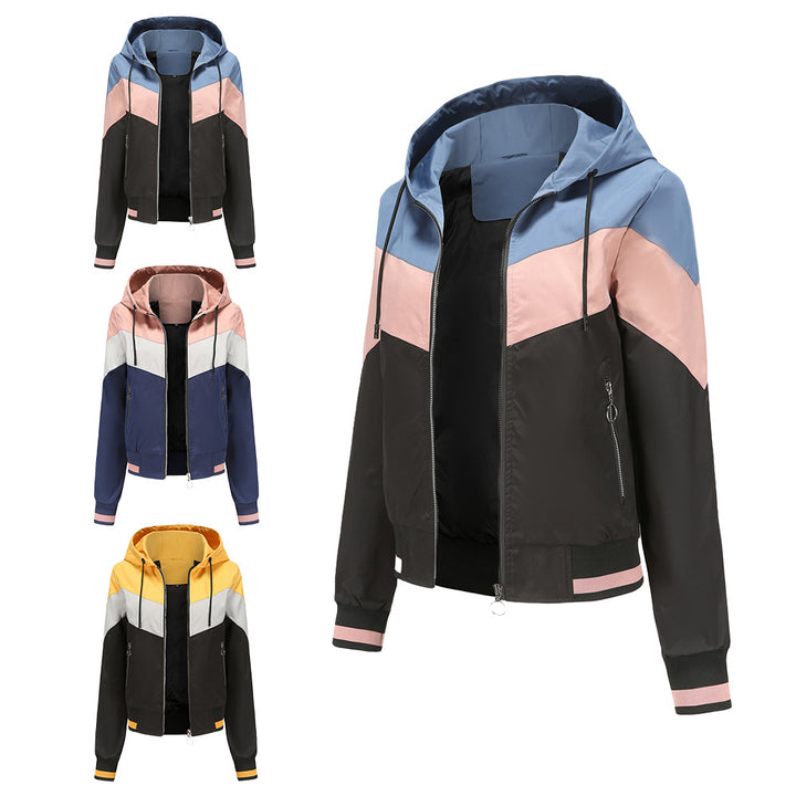 Women's lightweight windbreaker jacket with hood, block panel design, zippered pockets, and elastic hem Mune Fashion