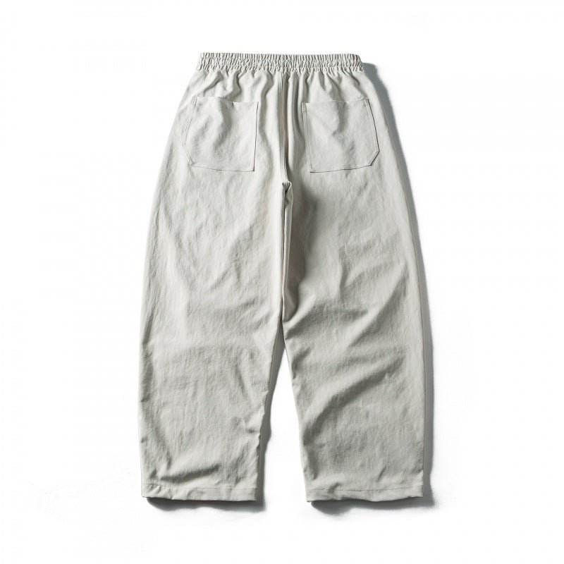 Unisex Wide Cropped Pants with Drawstring, Elastic Waistband and Distinctive Seam Panels Mune Fashion