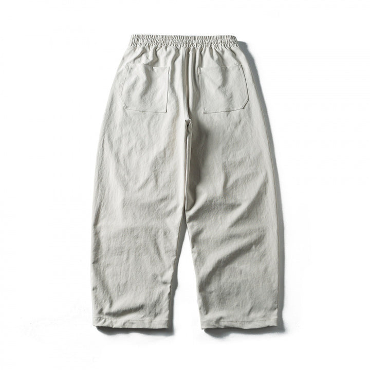 Unisex Wide Cropped Pants with Drawstring, Elastic Waistband and Distinctive Seam Panels Mune Fashion