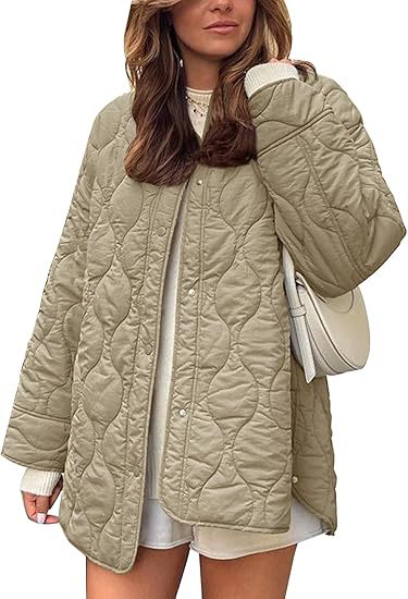 Women's quilted jacket in oversized design with curved quilting and side slit Mune Fashion