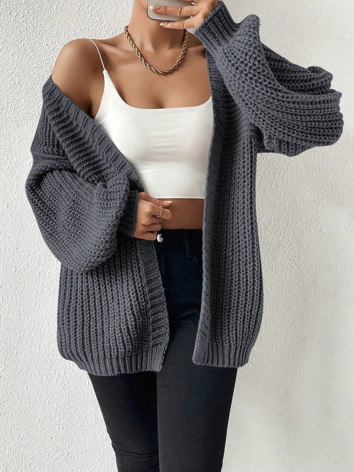 Women's oversized knit cardigan with coarse waffle knit, open front and voluminous balloon sleeves Mune Fashion