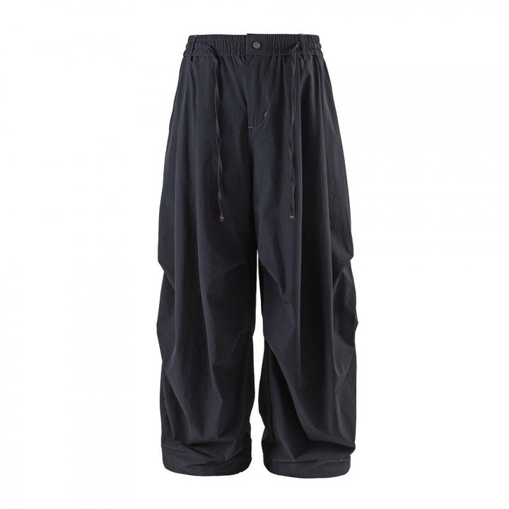 Unisex Loose-fitting technical cargo pants with elastic waistband, drawstring, and zip pockets Mune Fashion