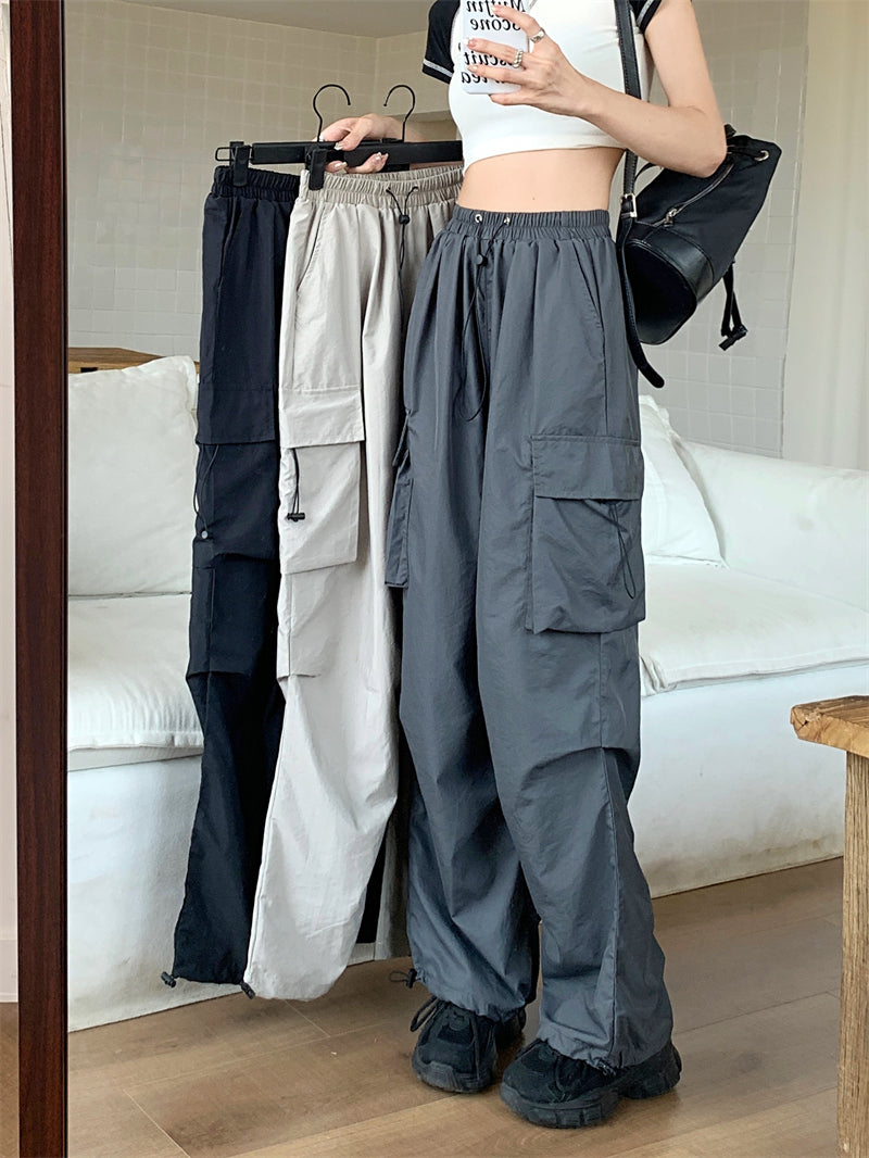 Women's wide cargo pants with drawstring waistband, adjustable leg cuffs, and large flap pockets Mune Fashion