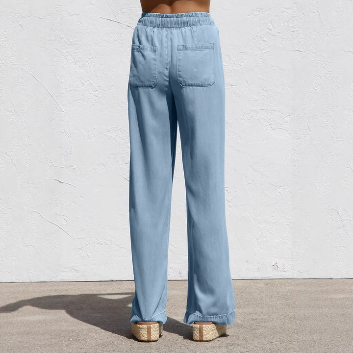 Ladies' wide linen-look summer trousers with elastic waistband, drawstring, and side pockets Mune Fashion