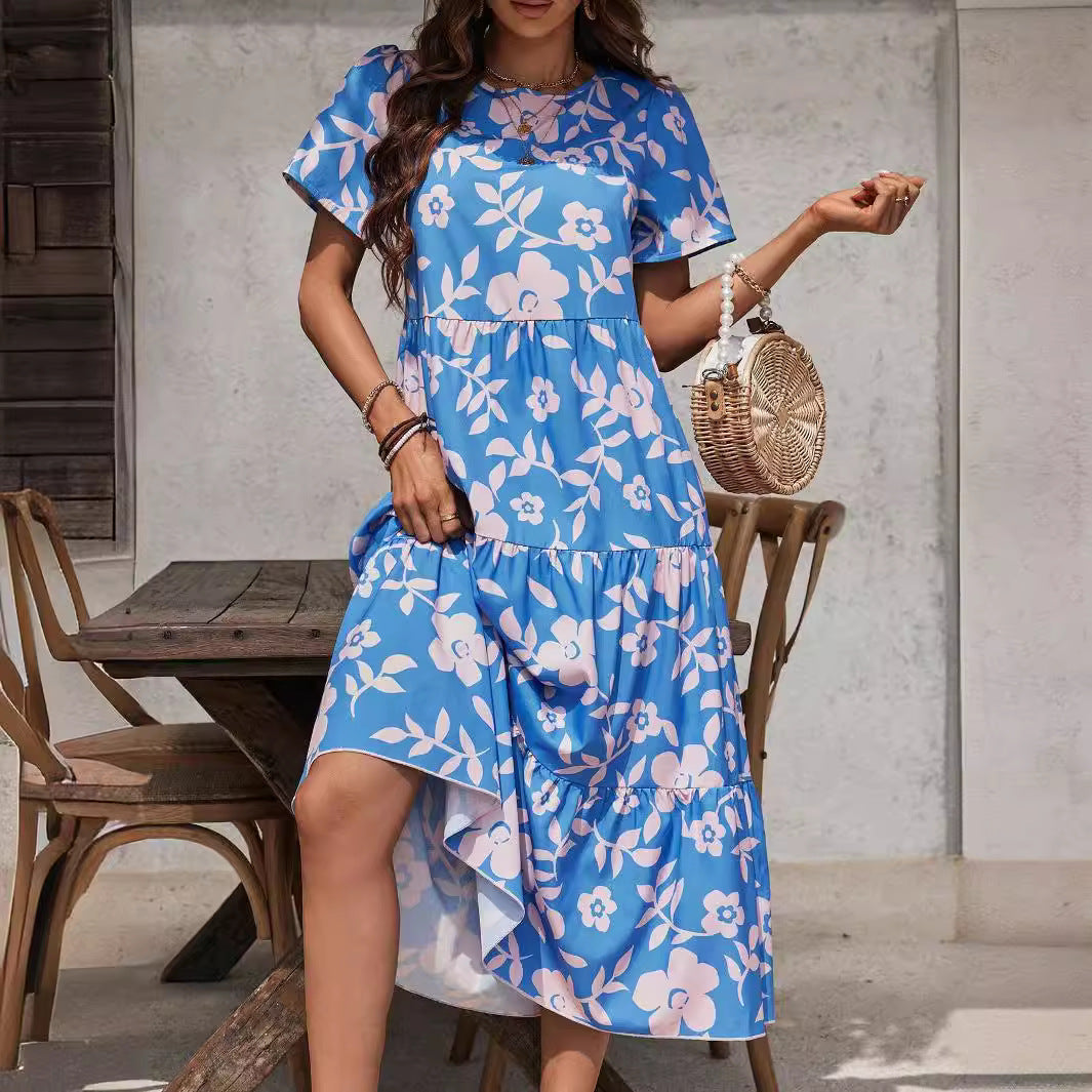 Ladies airy tiered midi dress with high waist seam, short sleeve and all-over floral pattern Mune Fashion