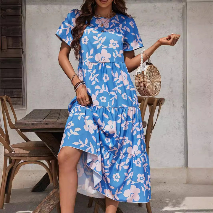 Ladies airy tiered midi dress with high waist seam, short sleeve and all-over floral pattern Mune Fashion