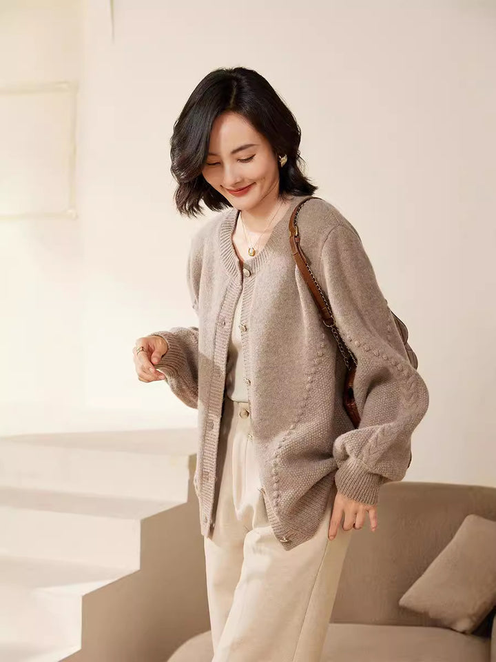 Women's knitted cardigan with textured pattern, balloon sleeves and pearly button placket Mune Fashion