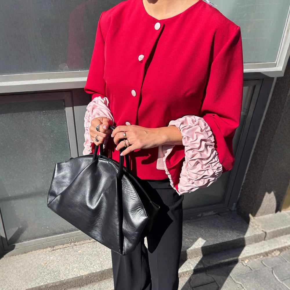 Ladies short blazer with contrasting ruffle hems, round neckline and concealed button placket Mune Fashion