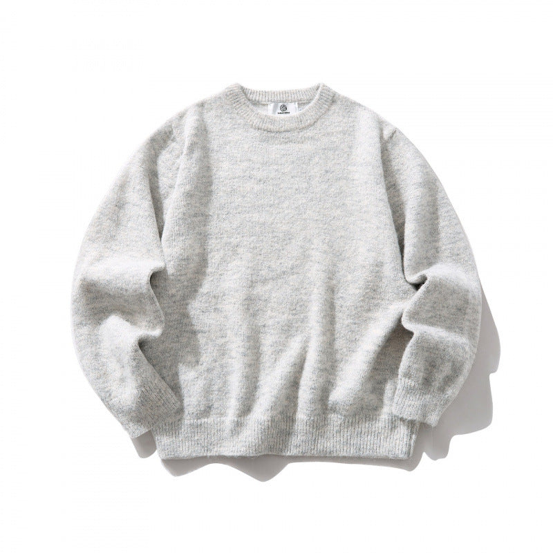 Unisex Oversize fine knit sweater with round neckline, ribbed cuffs, and mottled wool blend Mune Fashion