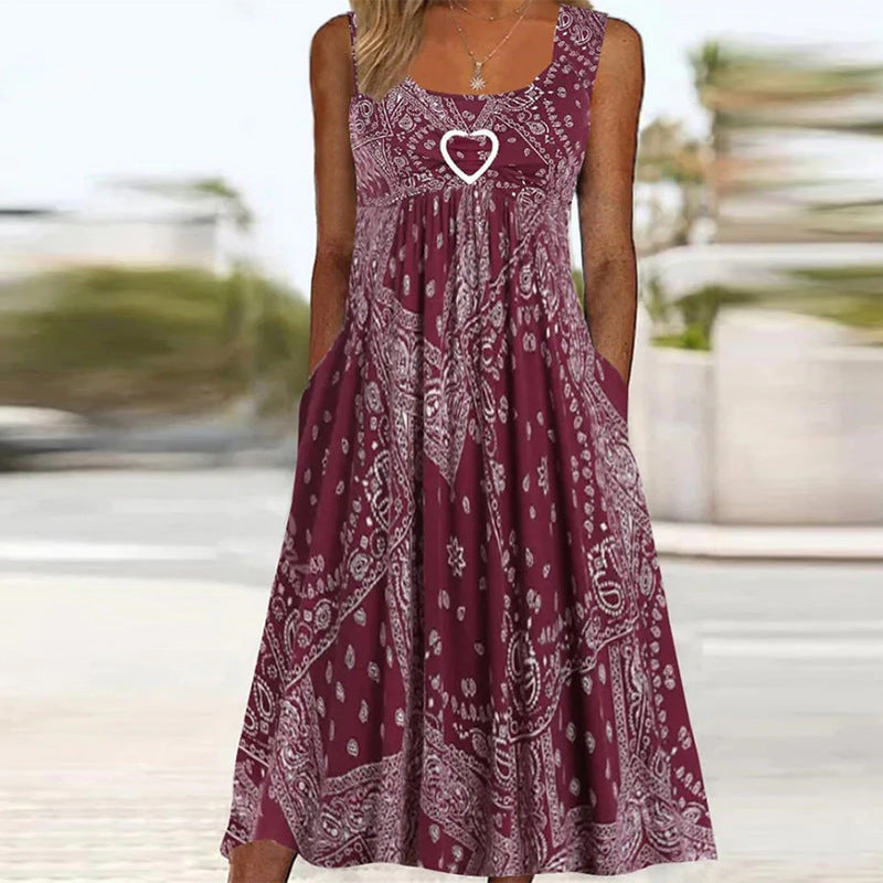 Women's airy maxi dress with paisley bandana print, gathered empire waist and practical side pockets Mune Fashion