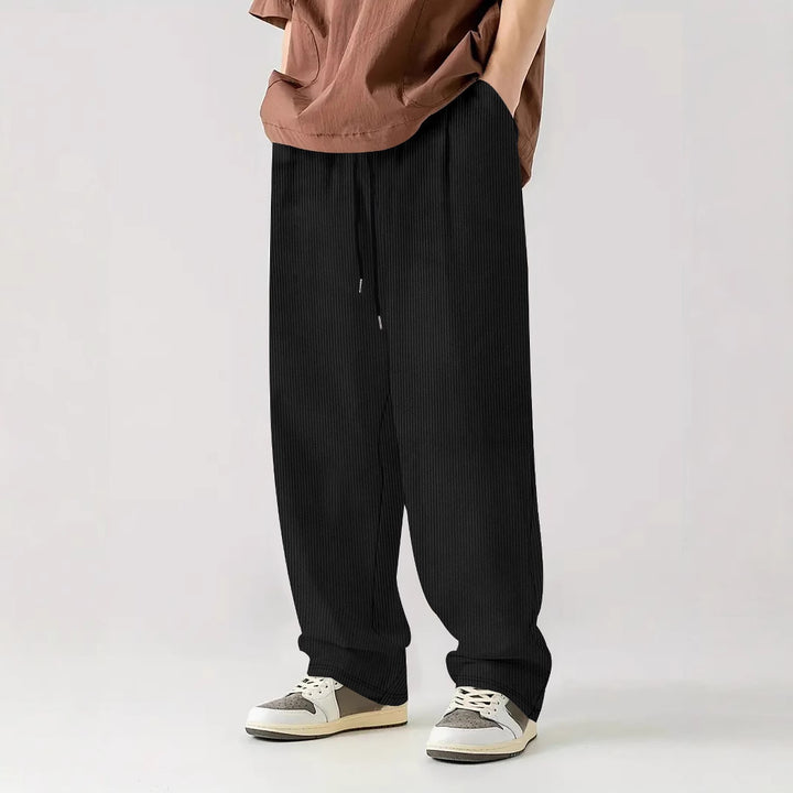 Men's loose Relax leisure pants made of ribbed jersey with drawstring, side pockets, and wide leg Mune Fashion