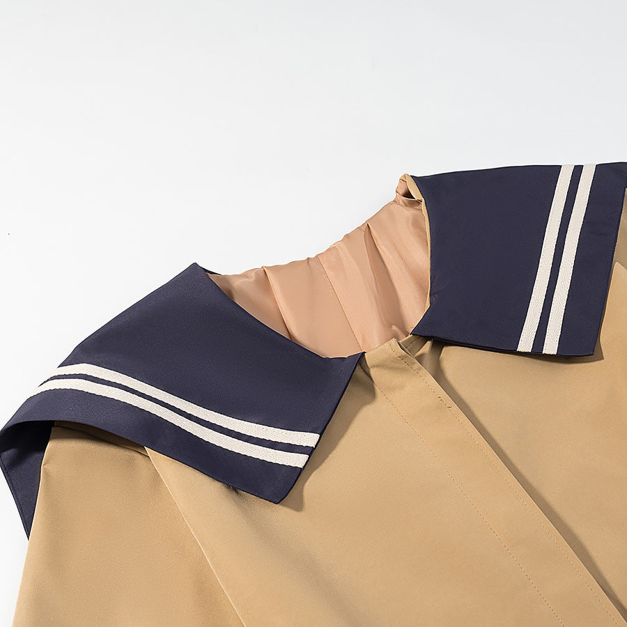Women's trench coat with oversized sailor collar, waist belt, and concealed button placket Mune Fashion