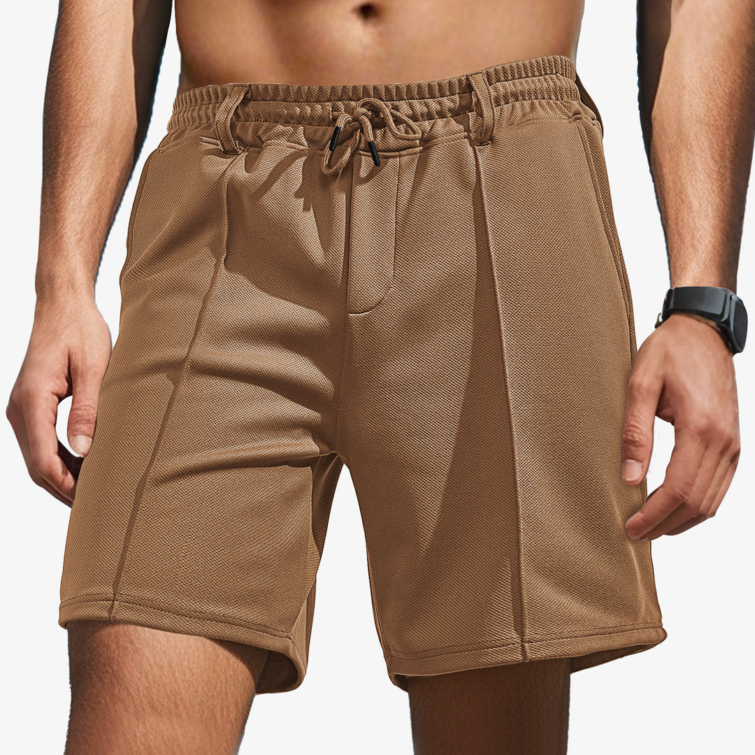 Men's knee-length sports shorts with mesh structure, elastic drawstring, and belt loops Mune Fashion