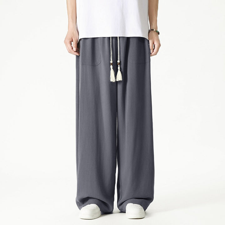 Men's loose-fitting lounge pants with tassel cord, elastic waistband, and patch pockets Mune Fashion