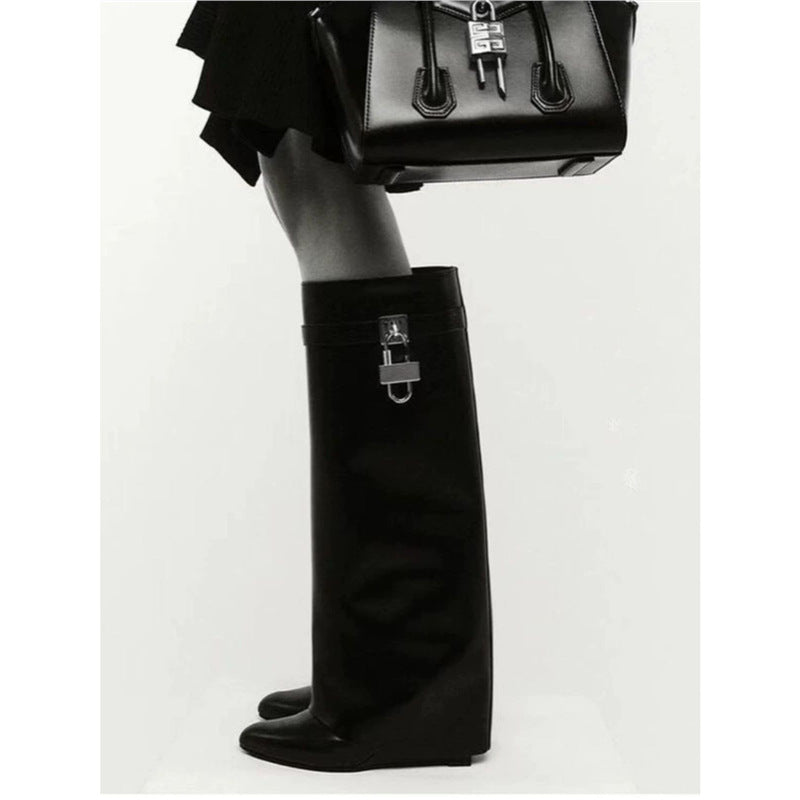 Women's knee-high faux leather boots with pointed toe, flat heel, and buckle appliqué Mune Fashion