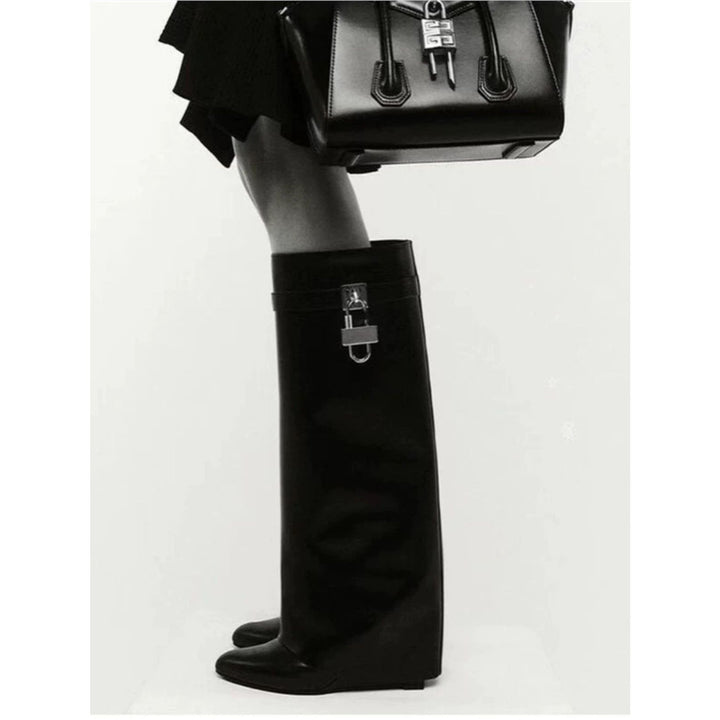 Women's knee-high faux leather boots with pointed toe, flat heel, and buckle appliqué Mune Fashion