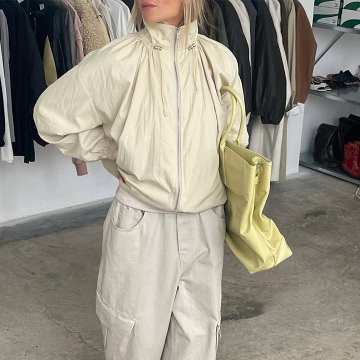 Women's Oversize Windbreaker with high stand-up collar, drawstring shoulder yoke, and balloon sleeves Mune Fashion
