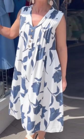 Women's sleeveless A-line midi dress with V-neck, bust pleats, button placket, and large floral print Mune Fashion