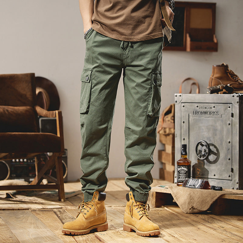 Men's robustly constructed cargo pants in jogger style with drawstring waistband, flap pockets, and elastic ankle cuffs Mune Fashion