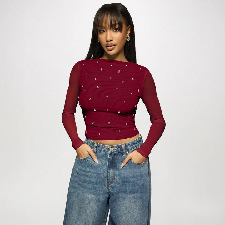 Women's fitted mesh top with rhinestone applications and boat neck Mune Fashion
