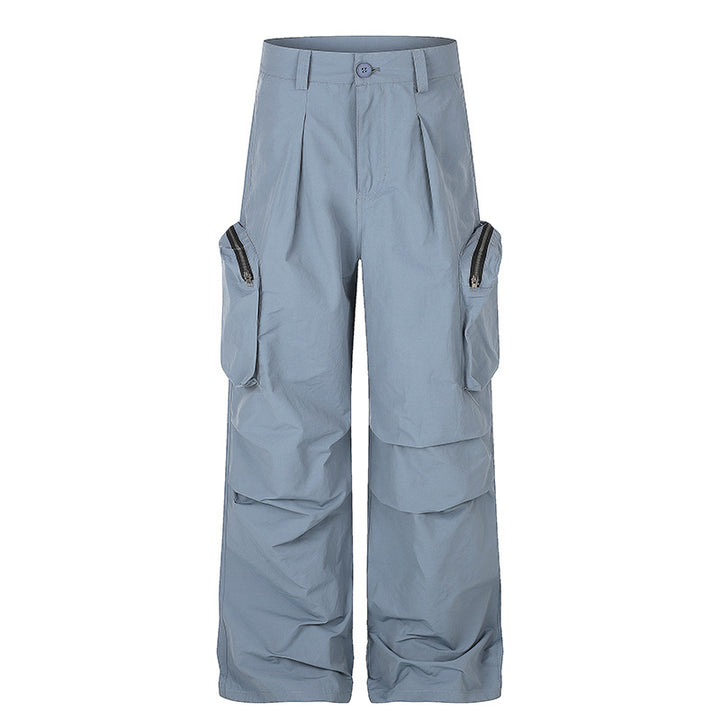 Women wide-cut cargo palazzo pants with high waist, zip pockets and layered panels Mune Fashion