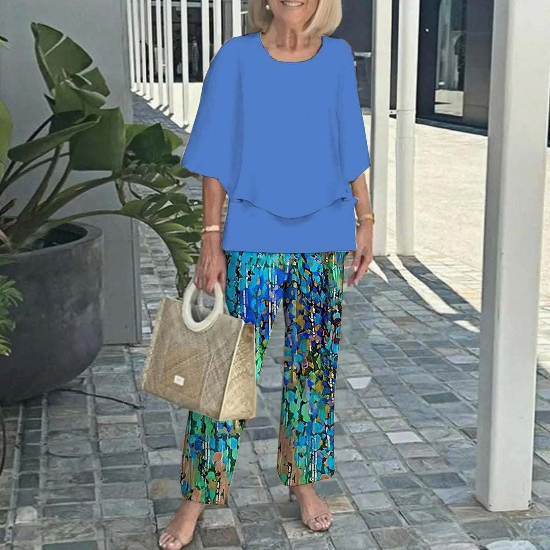 Women's layered tunic with cape sleeves and ankle-length straight leg pants with graphic print Mune Fashion