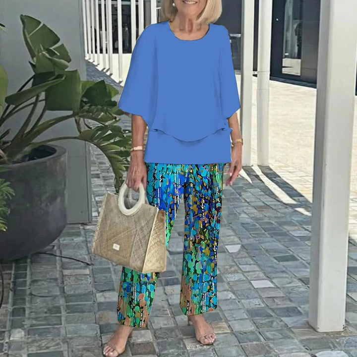 Women's layered tunic with cape sleeves and ankle-length straight leg pants with graphic print Mune Fashion