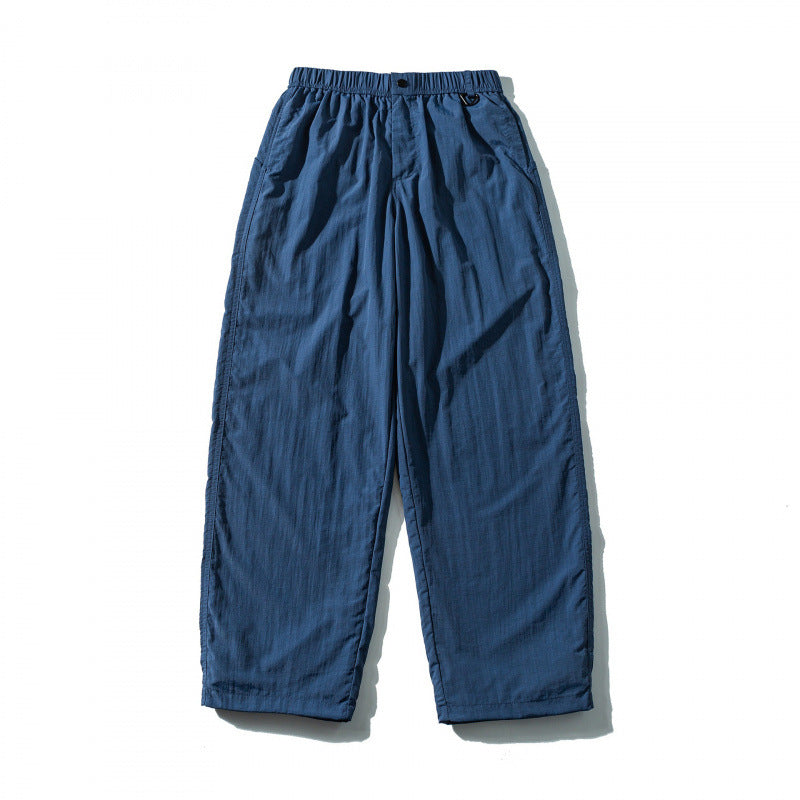 Unisex Loose Crinkle Pants with elastic drawstring waistband, drop-crotch, and side pockets Mune Fashion