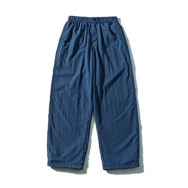 Unisex Loose Crinkle Pants with elastic drawstring waistband, drop-crotch, and side pockets Mune Fashion