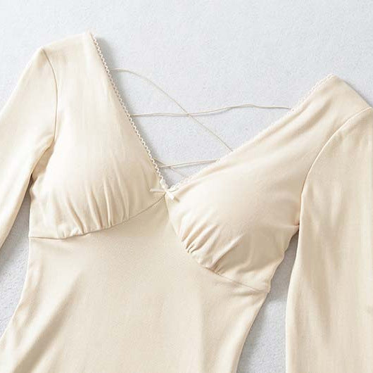 Ladies form-fitting mini dress with a deep V-neckline, gathered bust, and crossed back straps Mune Fashion
