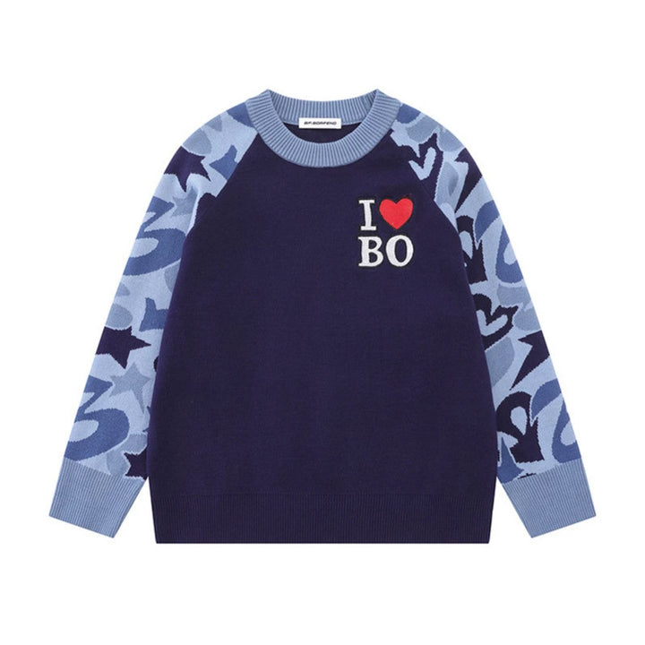 Women's knit sweater with raglan sleeves, statement jacquard sleeves, and ribbed hem Mune Fashion