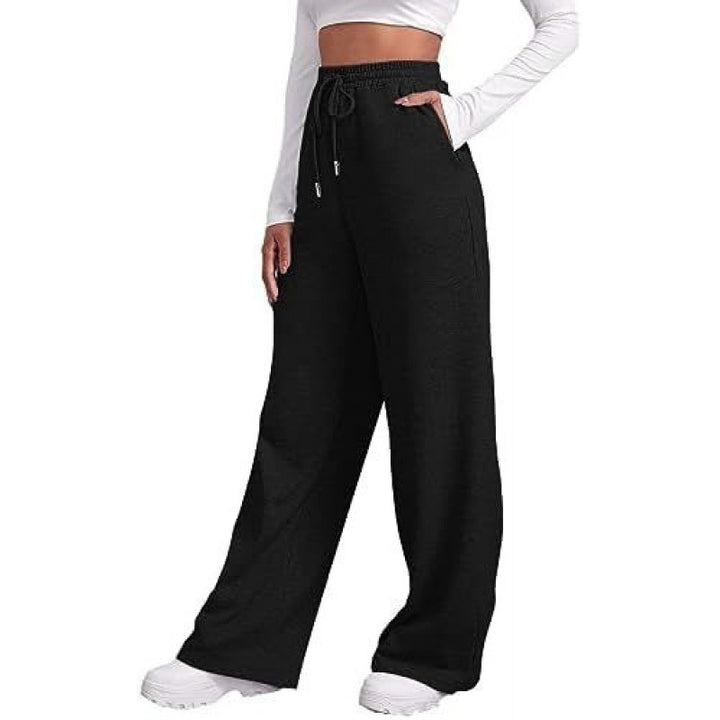 Women's flowing high-waist palazzo lounge pants made of lightweight jersey with elastic waistband and practical side pockets Mune Fashion
