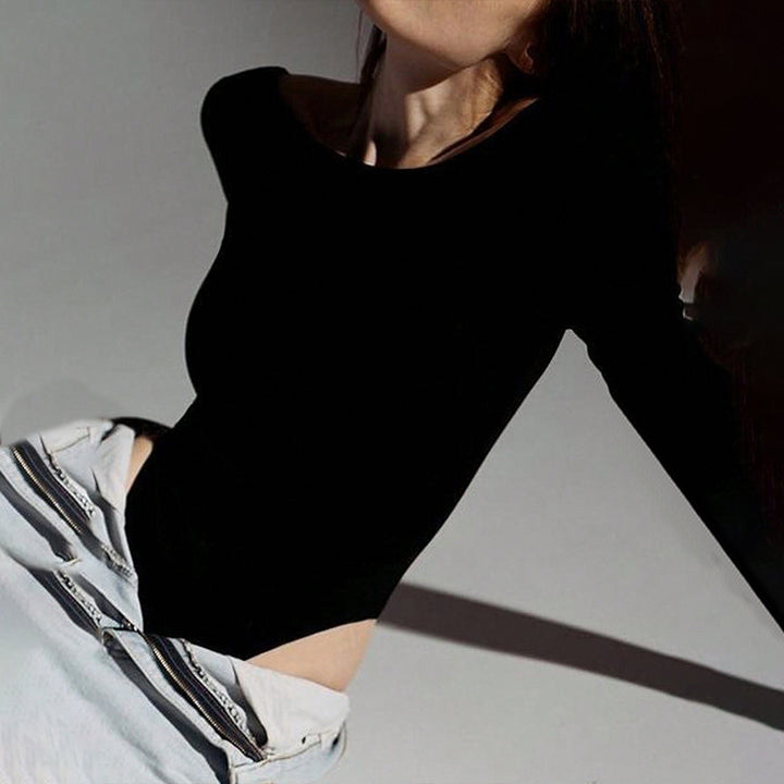 Women’s form-fitting long-sleeve bodysuit with high round neck, seamless fit, and stretchy jersey fabric.