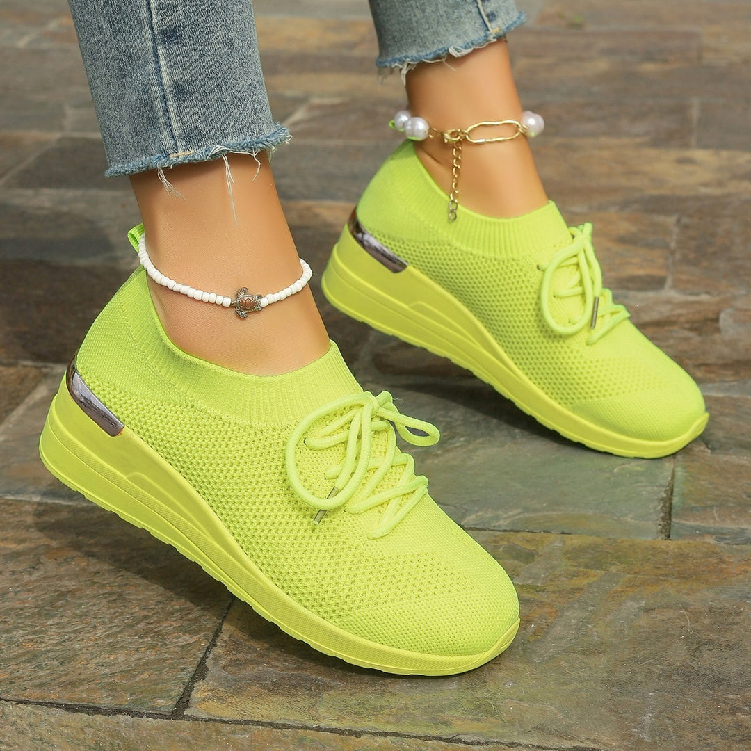 Women’s knit sneakers with wedge sole, sock-like shaft and metallic heel accent Mune Fashion