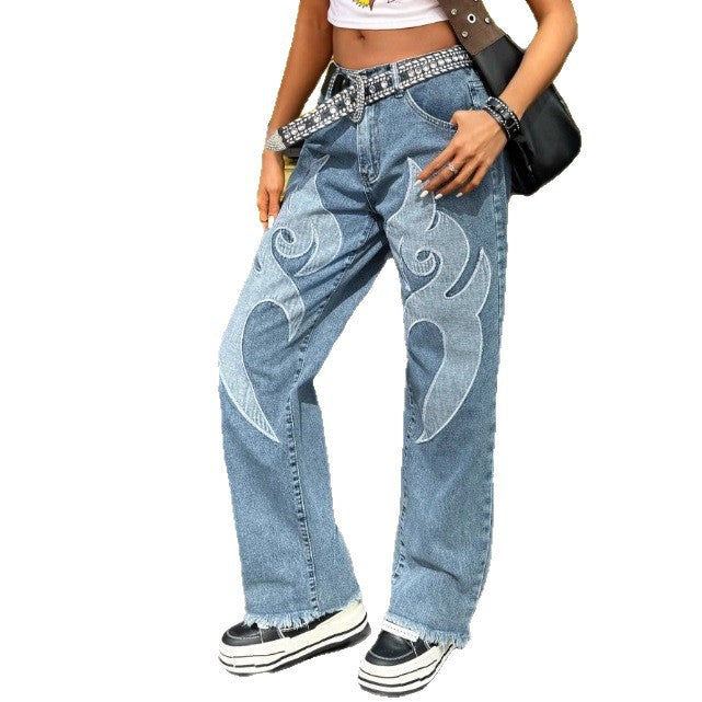Women wide denim jeans with tribal appliqué, raw hem and relaxed fit Mune Fashion