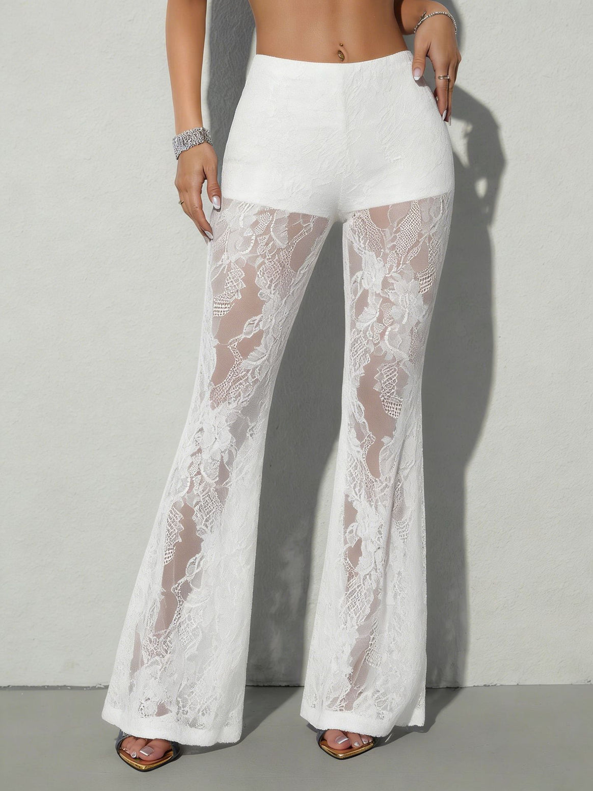 Women high-waisted lace flared pants with opaque inner shorts and floral transparent inserts Mune Fashion