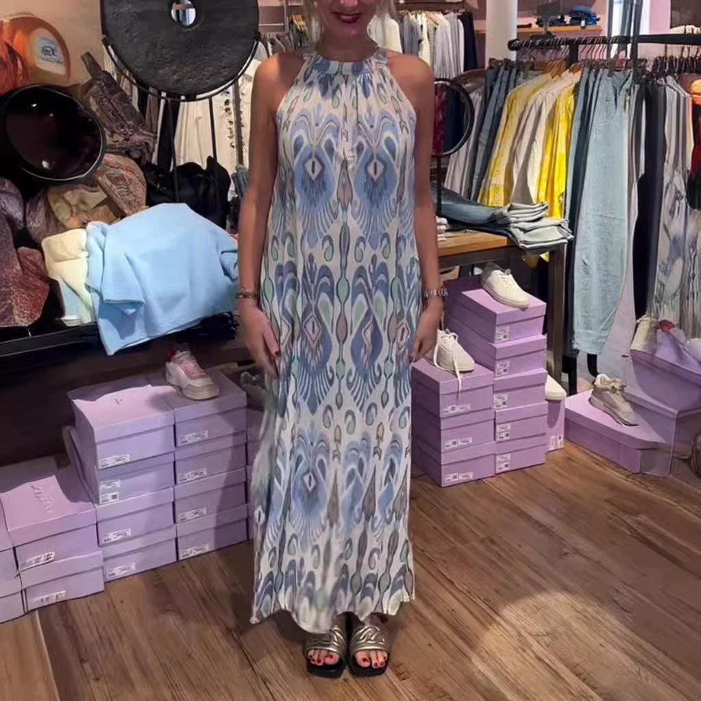 Women's flowing maxi dress with halter neck, ornamental ikat print and wide fall Mune Fashion