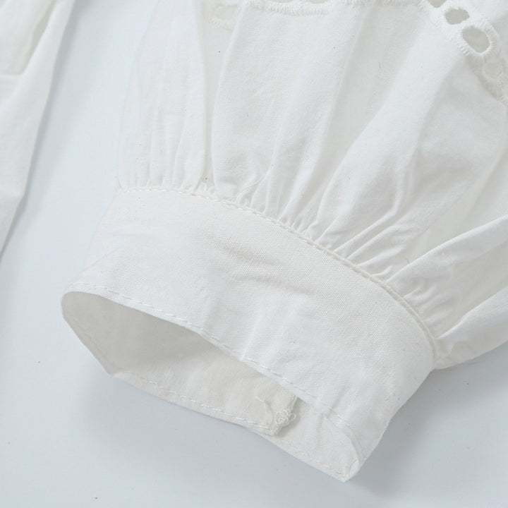 Women's blouse with V-neckline, broderie embroidery, and voluminous puff sleeves Mune Fashion