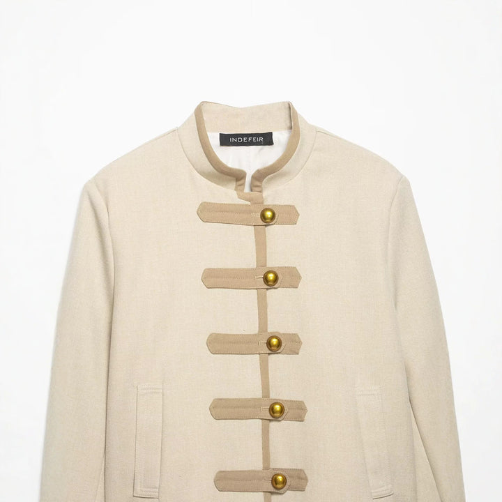 Ladies short jacket in military-inspired style with stand-up collar and decorative straps Mune Fashion