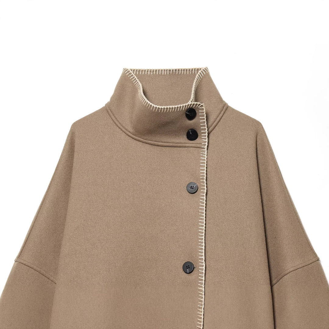 Women's cozy wool cape with high stand-up collar, asymmetrical button placket and decorative seam Mune Fashion