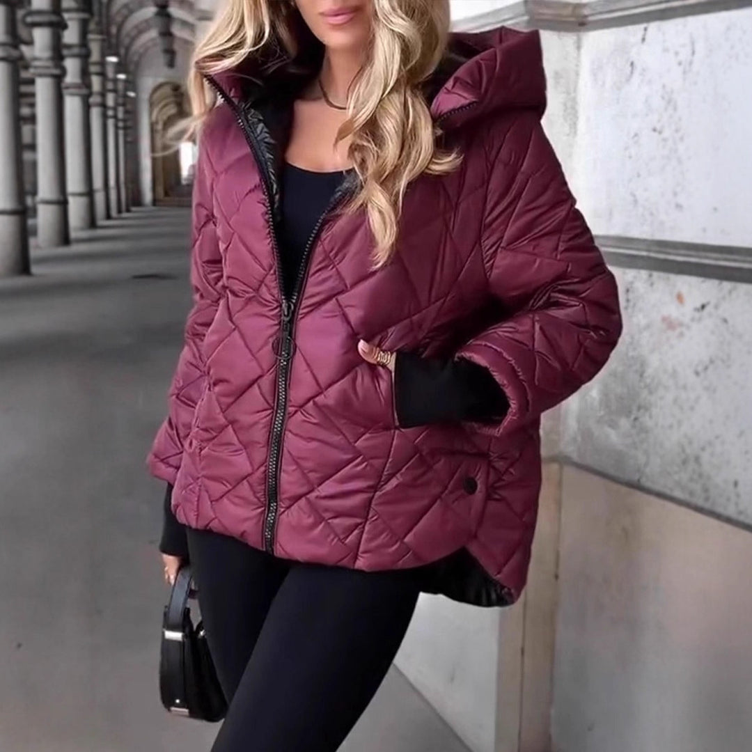 Women's quilted hooded winter jacket with padded thermal filling, full-length zipper, and elastic cuffs Mune Fashion